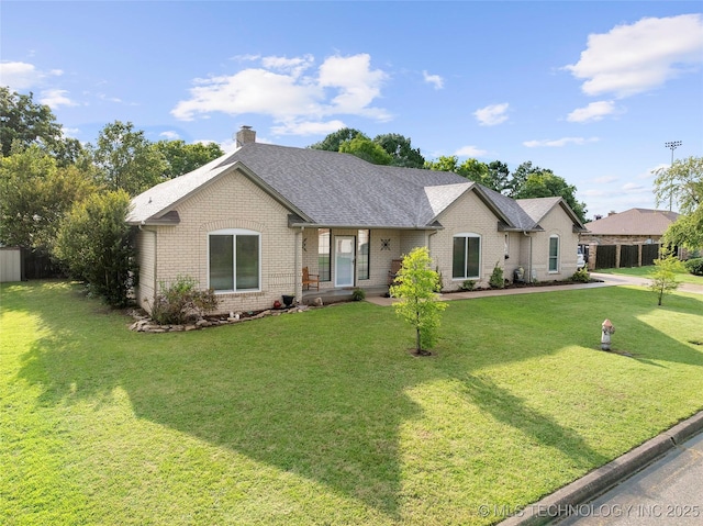1507 Southern Hills Dr, Ardmore, OK 73401 - ranch-style house with brick siding, a front lawn, a chimney, and a shingled roof