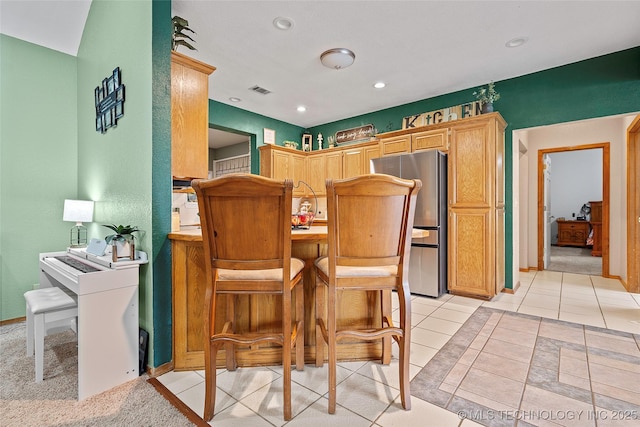 1507 Southern Hills Dr, Ardmore, OK 73401 - kitchen with freestanding refrigerator, recessed lighting, and light tile patterned floors