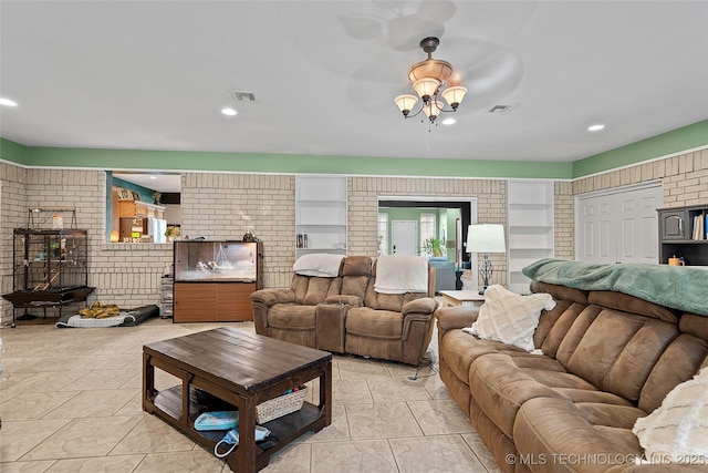 1507 Southern Hills Dr, Ardmore, OK 73401 - living room with a ceiling fan, brick wall, built in features, and recessed lighting