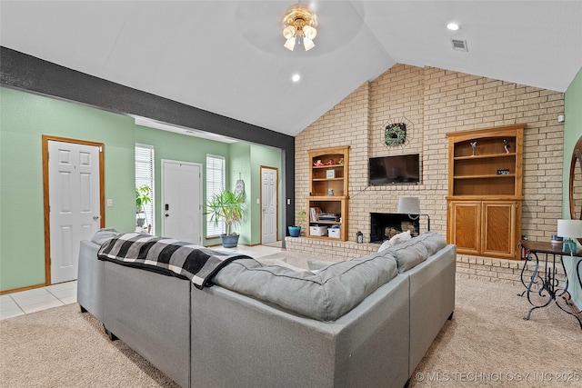 1507 Southern Hills Dr, Ardmore, OK 73401 - living room featuring lofted ceiling, built in features, light colored carpet, a fireplace, and ceiling fan