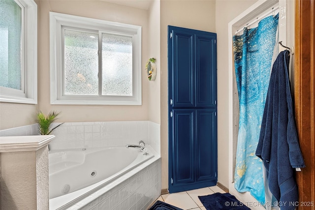 1507 Southern Hills Dr, Ardmore, OK 73401 - bathroom featuring a jetted tub and tile patterned floors