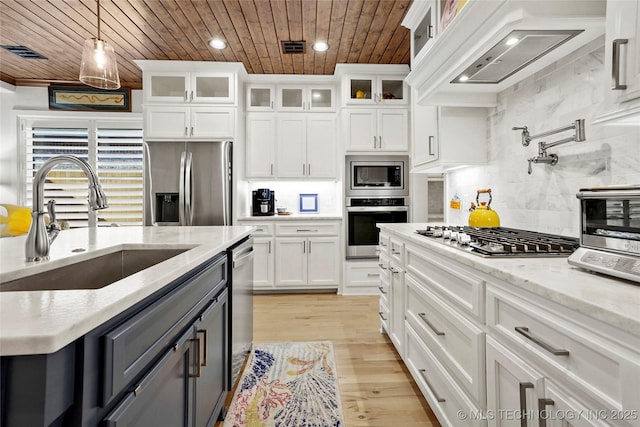 5314 E 126th St S, Bixby, OK 74008 - kitchen with stainless steel appliances, wooden ceiling, extractor fan, backsplash, and white cabinetry