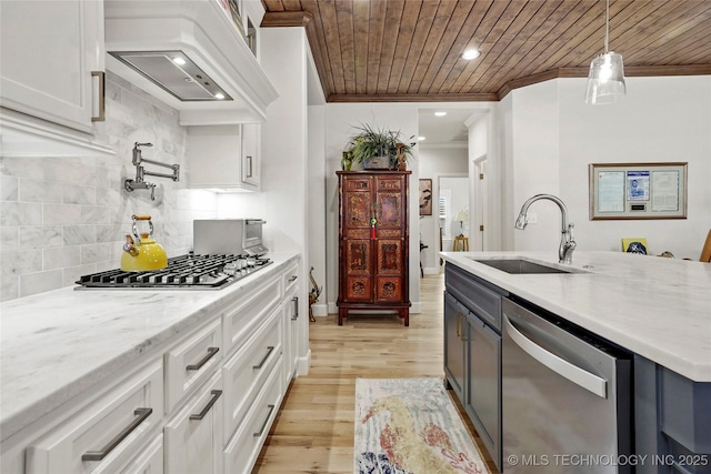 5314 E 126th St S, Bixby, OK 74008 - kitchen with appliances with stainless steel finishes, ornamental molding, wood ceiling, range hood, and white cabinets