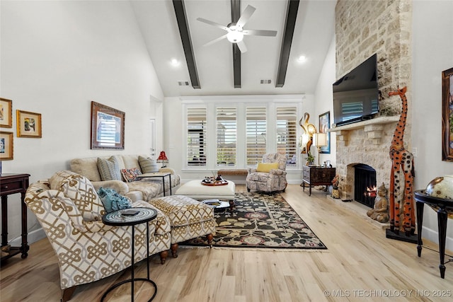 5314 E 126th St S, Bixby, OK 74008 - living area featuring ceiling fan, wood finished floors, high vaulted ceiling, a stone fireplace, and beam ceiling