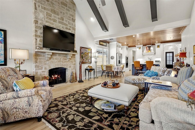 5314 E 126th St S, Bixby, OK 74008 - living area with light wood-style floors, a stone fireplace, high vaulted ceiling, and beam ceiling
