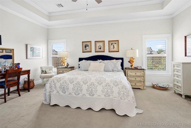 5314 E 126th St S, Bixby, OK 74008 - carpeted bedroom featuring a raised ceiling, multiple windows, ornamental molding, and ceiling fan
