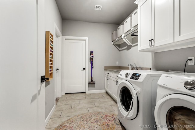 524 N 85th St, Broken Arrow, OK 74014 - laundry room featuring separate washer and dryer, cabinet space, and light tile patterned floors