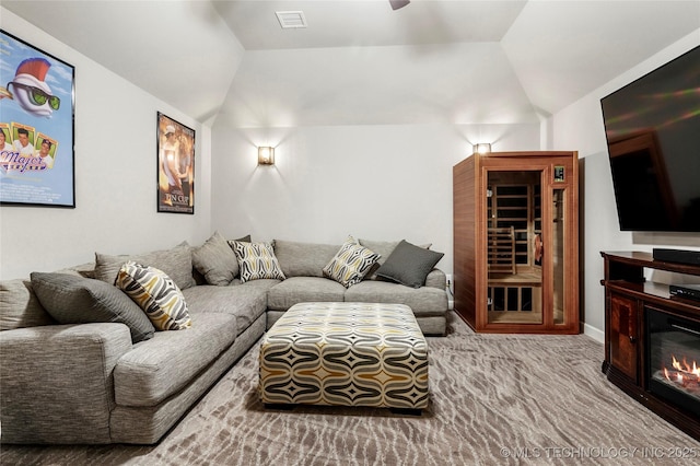 524 N 85th St, Broken Arrow, OK 74014 - living area featuring lofted ceiling, carpet, ceiling fan, and a glass covered fireplace