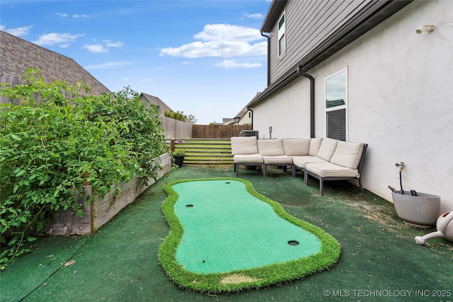 524 N 85th St, Broken Arrow, OK 74014 - fenced backyard featuring a putting area and an outdoor living space