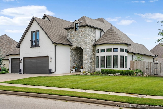 524 N 85th St, Broken Arrow, OK 74014 - french country inspired facade with stucco siding, stone siding, a shingled roof, and concrete driveway