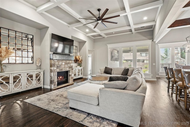 524 N 85th St, Broken Arrow, OK 74014 - living room with ceiling fan, wood finished floors, coffered ceiling, a stone fireplace, and beamed ceiling