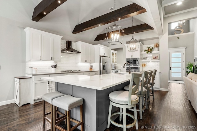 524 N 85th St, Broken Arrow, OK 74014 - kitchen featuring wall chimney exhaust hood, stainless steel appliances, open shelves, a chandelier, and a kitchen breakfast bar