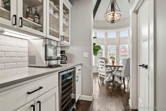 524 N 85th St, Broken Arrow, OK 74014 - bar featuring wine cooler, a chandelier, dark wood-style flooring, backsplash, and stainless steel microwave