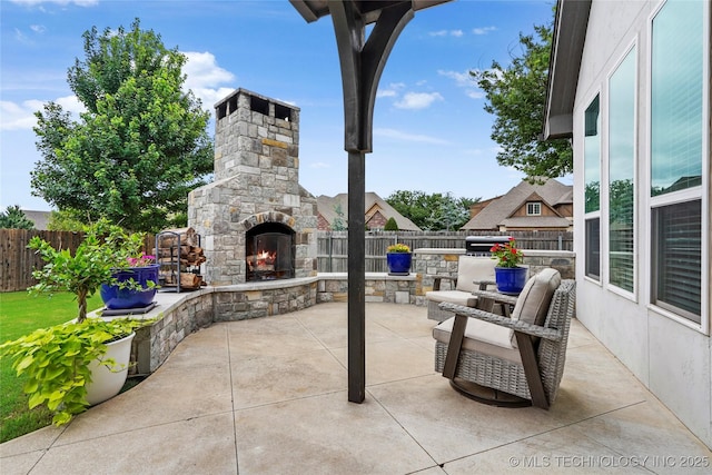 524 N 85th St, Broken Arrow, OK 74014 - view of patio with an outdoor stone fireplace