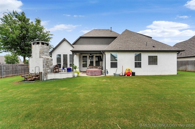 524 N 85th St, Broken Arrow, OK 74014 - back of property with a hot tub, roof with shingles, a fenced backyard, ceiling fan, and a patio area