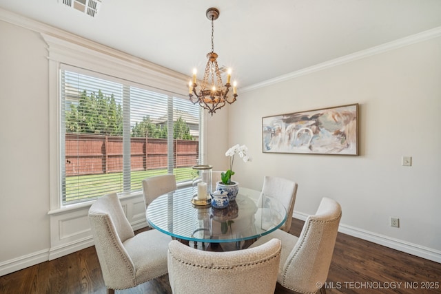 9545 E 108th St S, Bixby, OK 74133 - dining area featuring a chandelier, ornamental molding, and wood finished floors