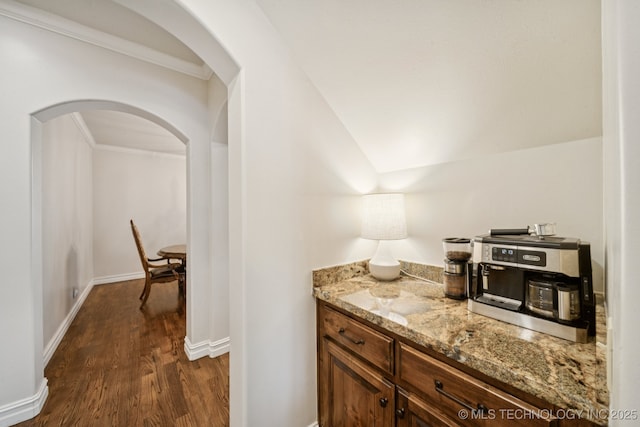 9545 E 108th St S, Bixby, OK 74133 - bar with dark wood-style floors, arched walkways, and ornamental molding