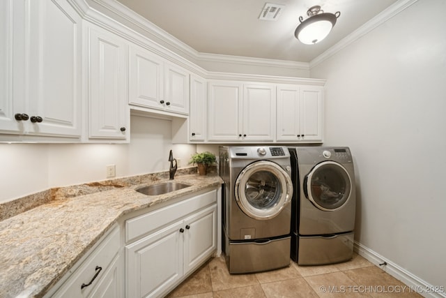 9545 E 108th St S, Bixby, OK 74133 - washroom with separate washer and dryer, cabinet space, light tile patterned floors, and crown molding