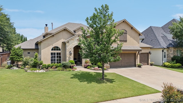 9545 E 108th St S, Bixby, OK 74133 - french country inspired facade with stucco siding, stone siding, a chimney, and driveway