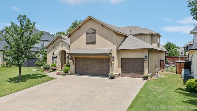 9545 E 108th St S, Bixby, OK 74133 - view of front facade with stucco siding, driveway, stone siding, and a shingled roof