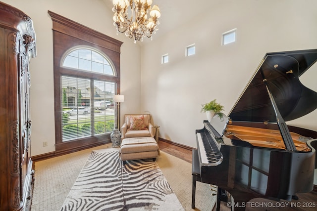 9545 E 108th St S, Bixby, OK 74133 - sitting room featuring a chandelier, carpet flooring, and a towering ceiling
