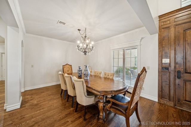 9545 E 108th St S, Bixby, OK 74133 - dining room featuring arched walkways, a chandelier, dark wood-style flooring, and crown molding