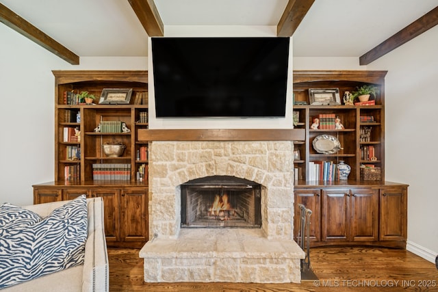 9545 E 108th St S, Bixby, OK 74133 - living area featuring beam ceiling, wood finished floors, and a stone fireplace