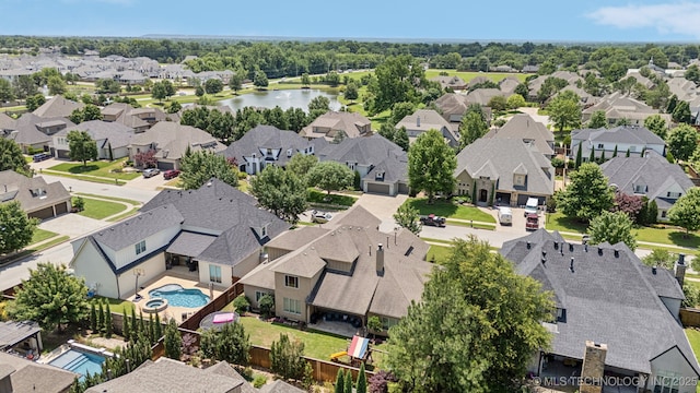 9545 E 108th St S, Bixby, OK 74133 - aerial view of residential area with a pool area and a nearby body of water