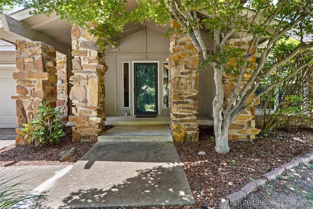 4224 E 84th St, Tulsa, OK 74137 - entrance to property featuring stone siding and a garage