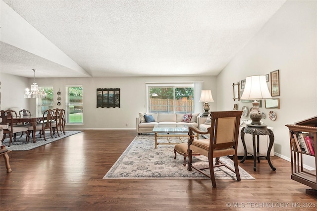 4224 E 84th St, Tulsa, OK 74137 - living area with a chandelier, vaulted ceiling, a textured ceiling, and wood finished floors