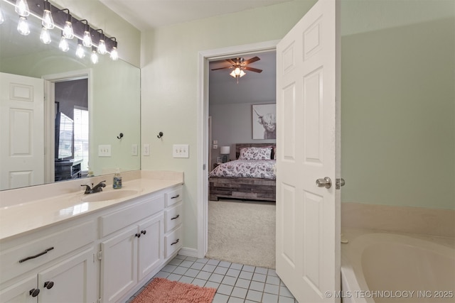 420 W 54th St, Sand Springs, OK 74063 - ensuite bathroom featuring vanity, tile patterned flooring, a garden tub, and ceiling fan