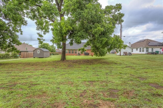 420 W 54th St, Sand Springs, OK 74063 - view of grassy yard with a storage shed