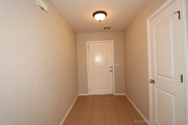 14313 E 112th Pl, Owasso, OK 74055 - hallway with light tile patterned floors and baseboards