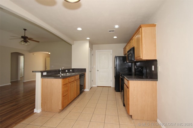 14313 E 112th Pl, Owasso, OK 74055 - kitchen featuring black appliances, a peninsula, arched walkways, ceiling fan, and recessed lighting