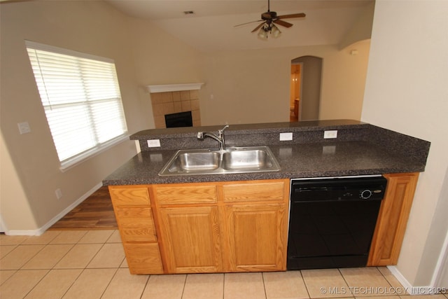 14313 E 112th Pl, Owasso, OK 74055 - kitchen with dishwasher, a ceiling fan, arched walkways, light tile patterned floors, and lofted ceiling