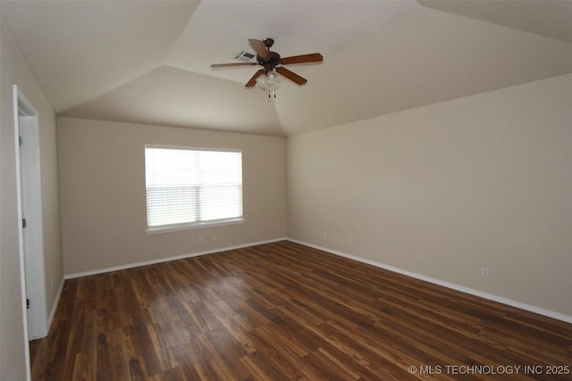 14313 E 112th Pl, Owasso, OK 74055 - spare room featuring vaulted ceiling, dark wood-type flooring, and a ceiling fan