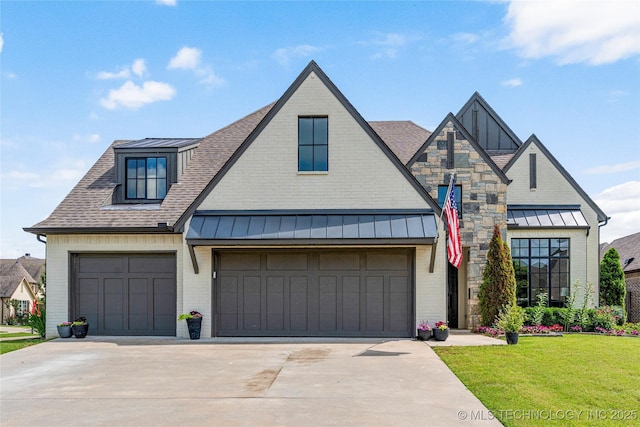 10470 E 123rd Pl S, Bixby, OK 74008 - view of front of property with a standing seam roof, concrete driveway, a front lawn, and roof with shingles