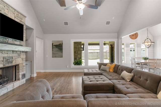 10470 E 123rd Pl S, Bixby, OK 74008 - living area featuring high vaulted ceiling, a ceiling fan, wood finished floors, and a fireplace