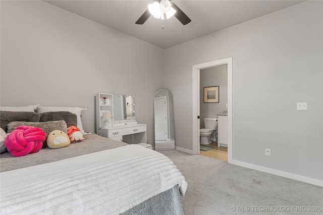 10470 E 123rd Pl S, Bixby, OK 74008 - bedroom featuring light carpet, connected bathroom, and ceiling fan