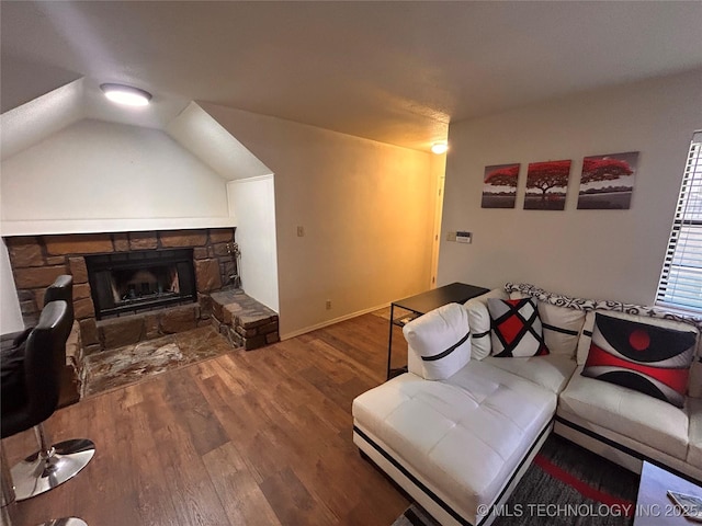 3402 S Winston Ave Unit 103, Tulsa, OK 74135 - living room featuring wood finished floors, a fireplace, and lofted ceiling