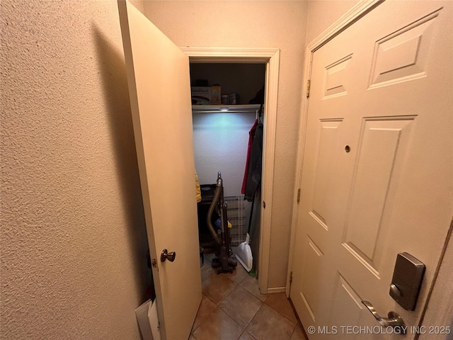 3402 S Winston Ave Unit 103, Tulsa, OK 74135 - corridor with a textured wall and tile patterned floors