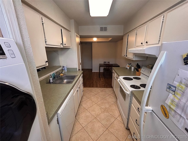 3402 S Winston Ave Unit 103, Tulsa, OK 74135 - kitchen featuring white appliances, under cabinet range hood, white cabinetry, and light tile patterned floors