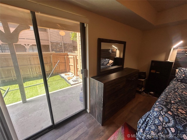 3402 S Winston Ave Unit 103, Tulsa, OK 74135 - bedroom with dark wood-type flooring and access to outside