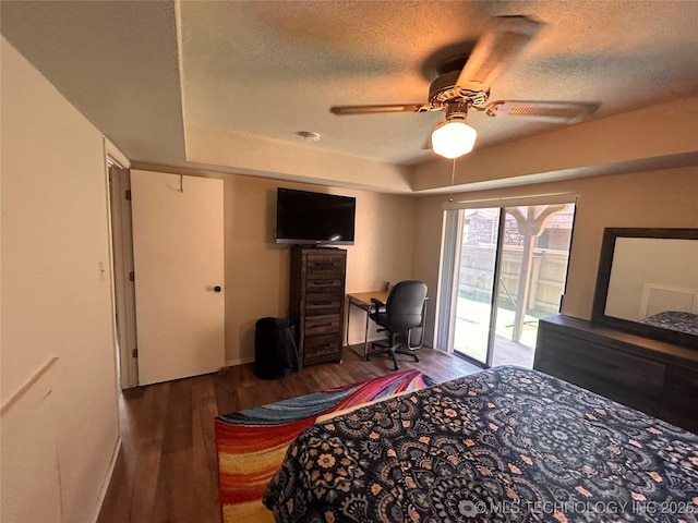 3402 S Winston Ave Unit 103, Tulsa, OK 74135 - bedroom featuring access to outside, wood finished floors, a textured ceiling, an office area, and a ceiling fan