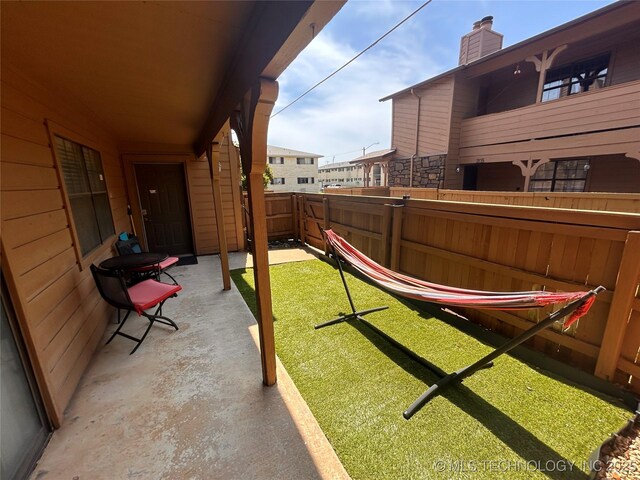 3402 S Winston Ave Unit 103, Tulsa, OK 74135 - view of yard with a patio area