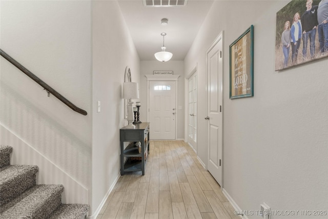 6605 S Elder Ave, Broken Arrow, OK 74011 - foyer with stairs and light wood-style flooring