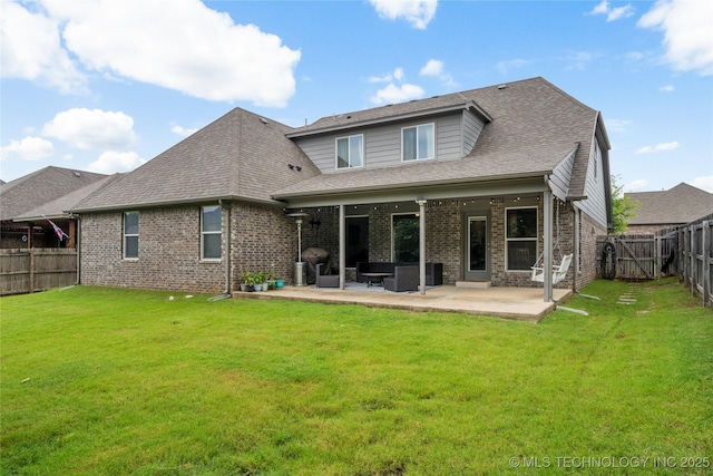 6605 S Elder Ave, Broken Arrow, OK 74011 - rear view of house with brick siding, a patio, a fenced backyard, and roof with shingles