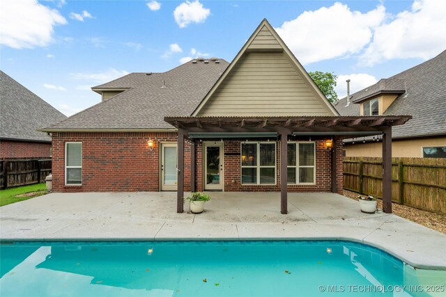 9722 S 75th E Ave, Tulsa, OK 74133 - back of house with a pergola, brick siding, a fenced backyard, a shingled roof, and a patio area