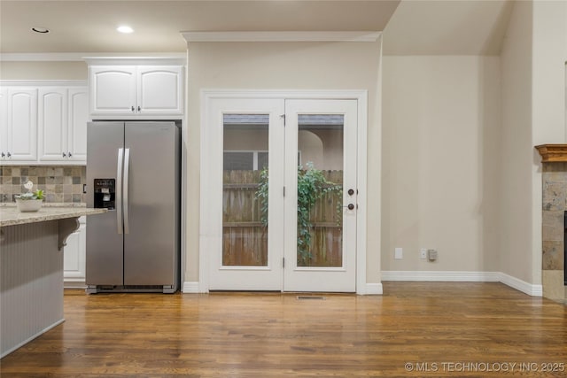 9722 S 75th E Ave, Tulsa, OK 74133 - kitchen with stainless steel refrigerator with ice dispenser, white cabinets, light stone countertops, dark wood-style floors, and crown molding