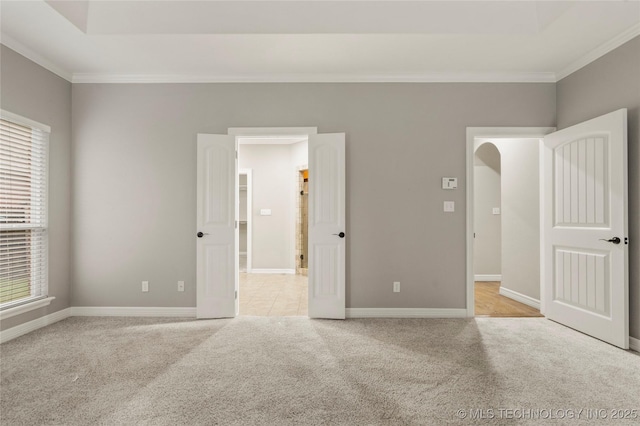 9722 S 75th E Ave, Tulsa, OK 74133 - unfurnished bedroom featuring crown molding and light colored carpet